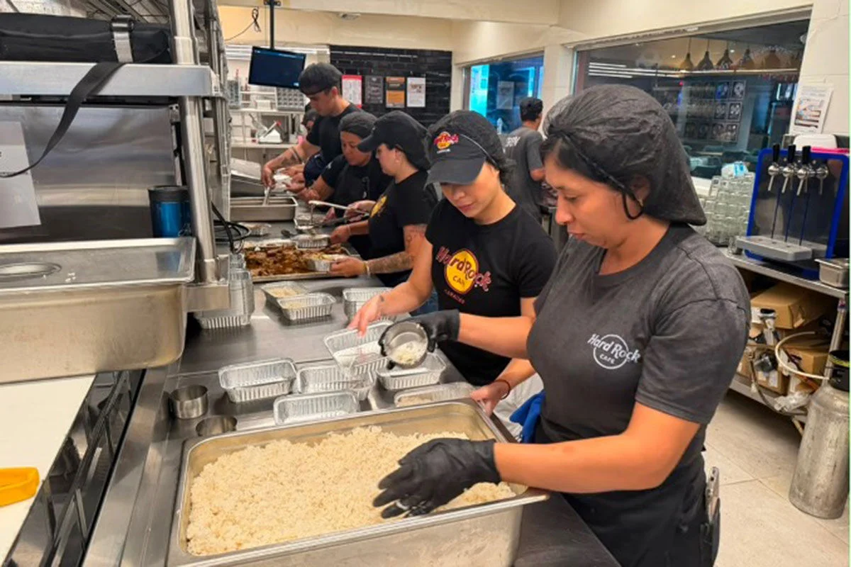 Hard Rock Cafe Caracas team members prepare fresh meals 