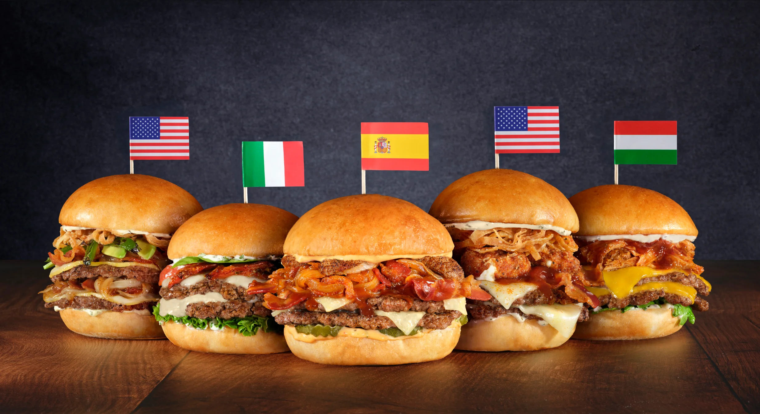 Burgers on a table with flags from different countries