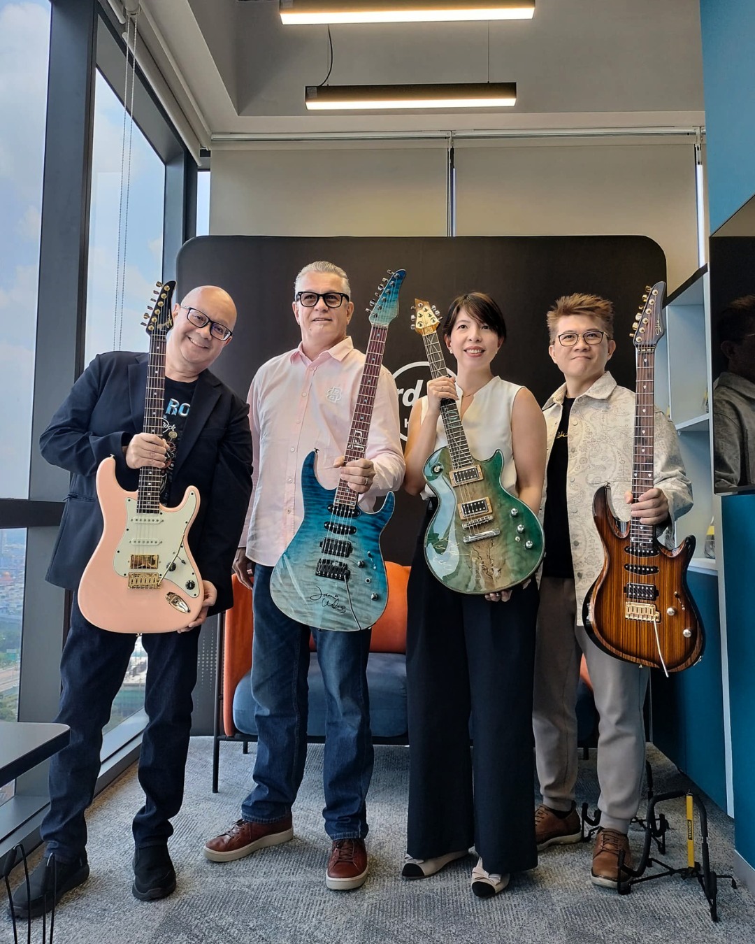 a group of people holding guitars