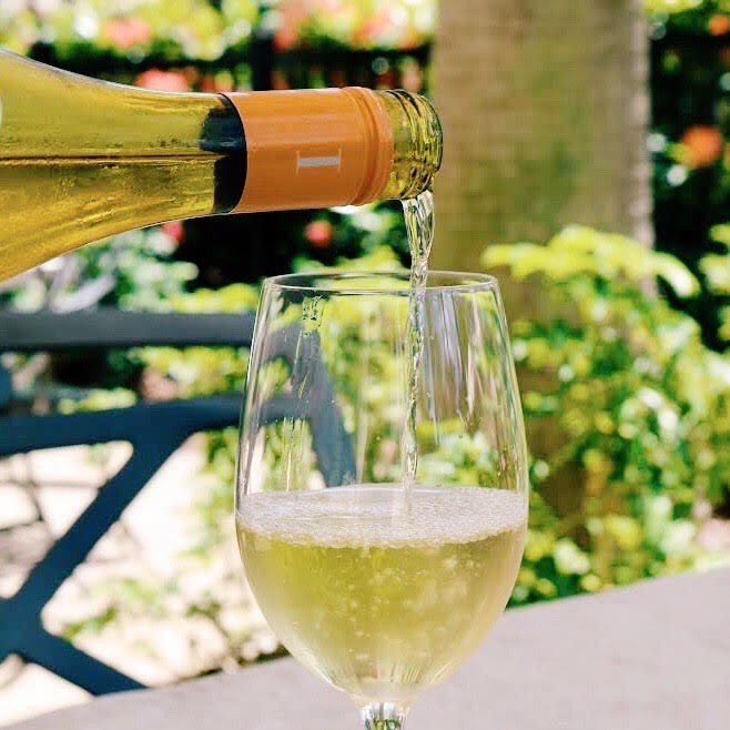 Pouring a glass of white wine